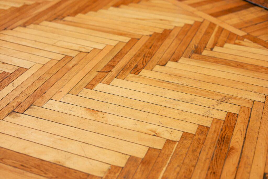 Close-up of a wooden parquet floor pattern, the finished surface that depends on a sound subfloor